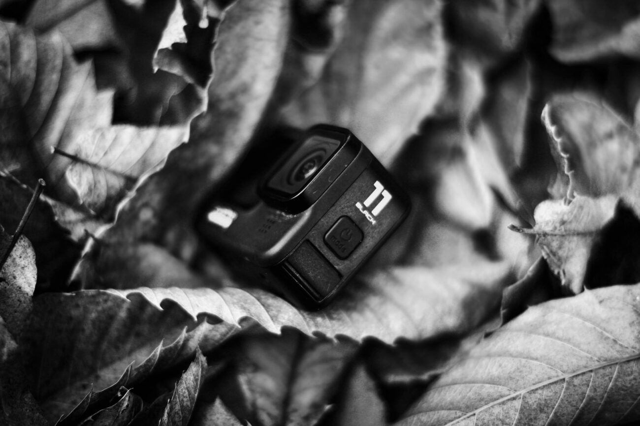 How to Set Up Action Camera Gear for Cinematic Video 1 Hands adjusting the touchscreen to set up action camera recording modes