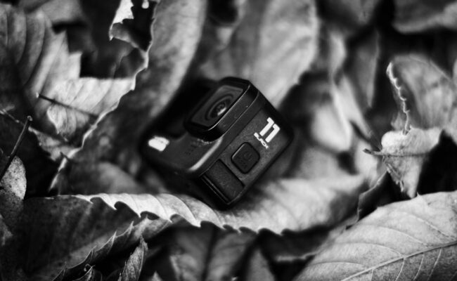 How to Set Up Action Camera Gear for Cinematic Video 3 Hands adjusting the touchscreen to set up action camera recording modes