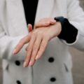 Why Your Smartwatch Keeps Disconnecting and How to Fix It 6 person checking display when smartwatch keeps disconnecting