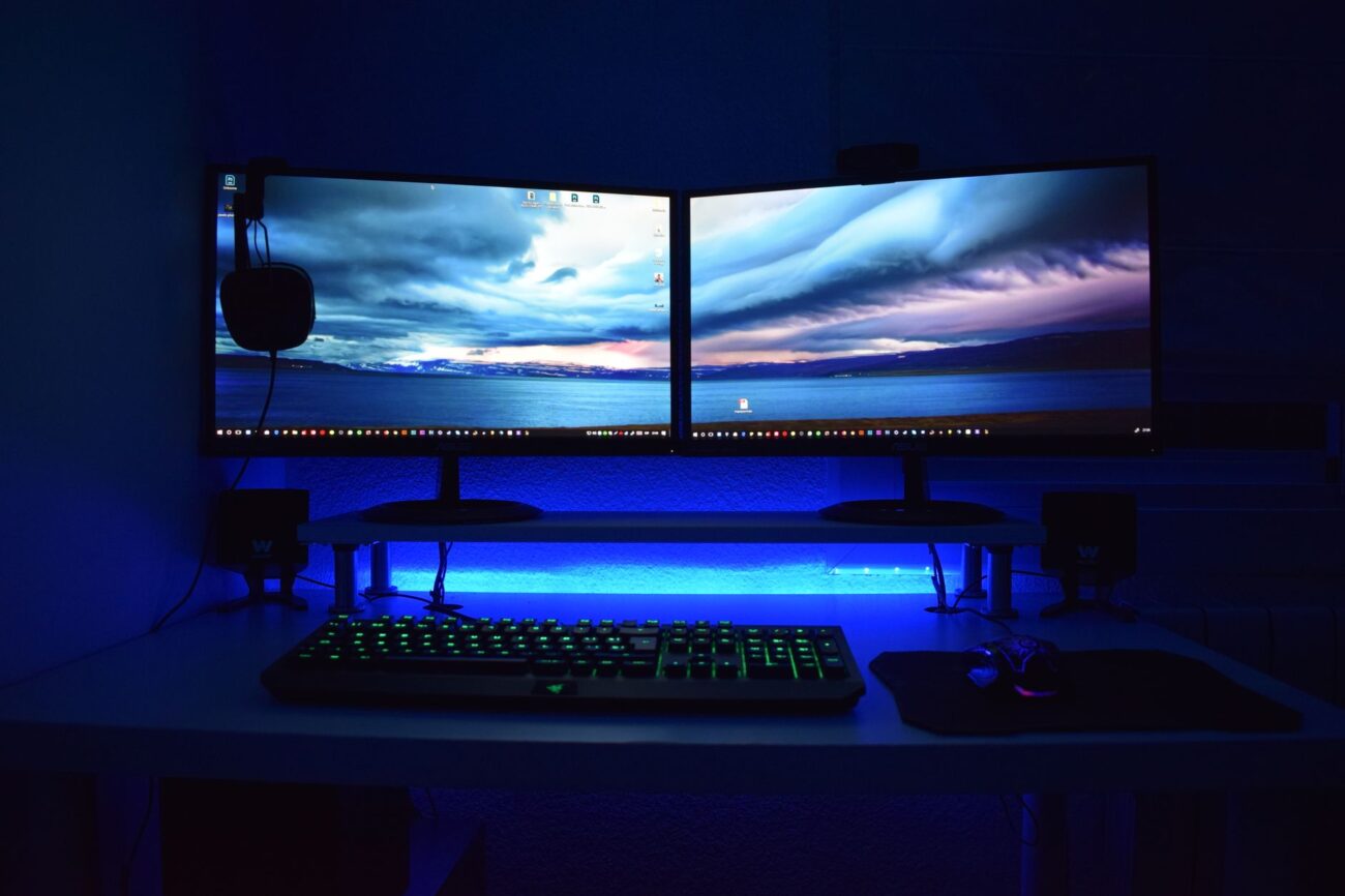 portable monitor vs desktop monitor side by side on desk