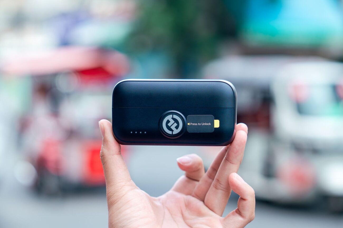 Power Bank vs Power Station: Which Should You Buy in 2026? 1 Person using a power bank to charge smartphone outdoors - power bank vs power station comparison