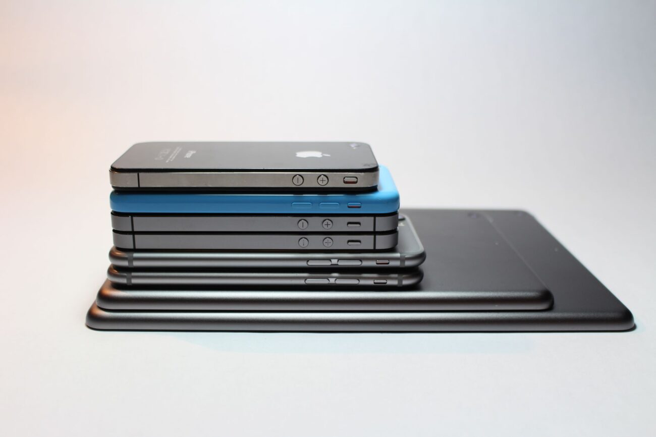 Power Bank vs Power Station: Which Should You Buy? 1 Person using a power bank to charge smartphone in outdoor setting demonstrating portable power solution for power bank vs power station