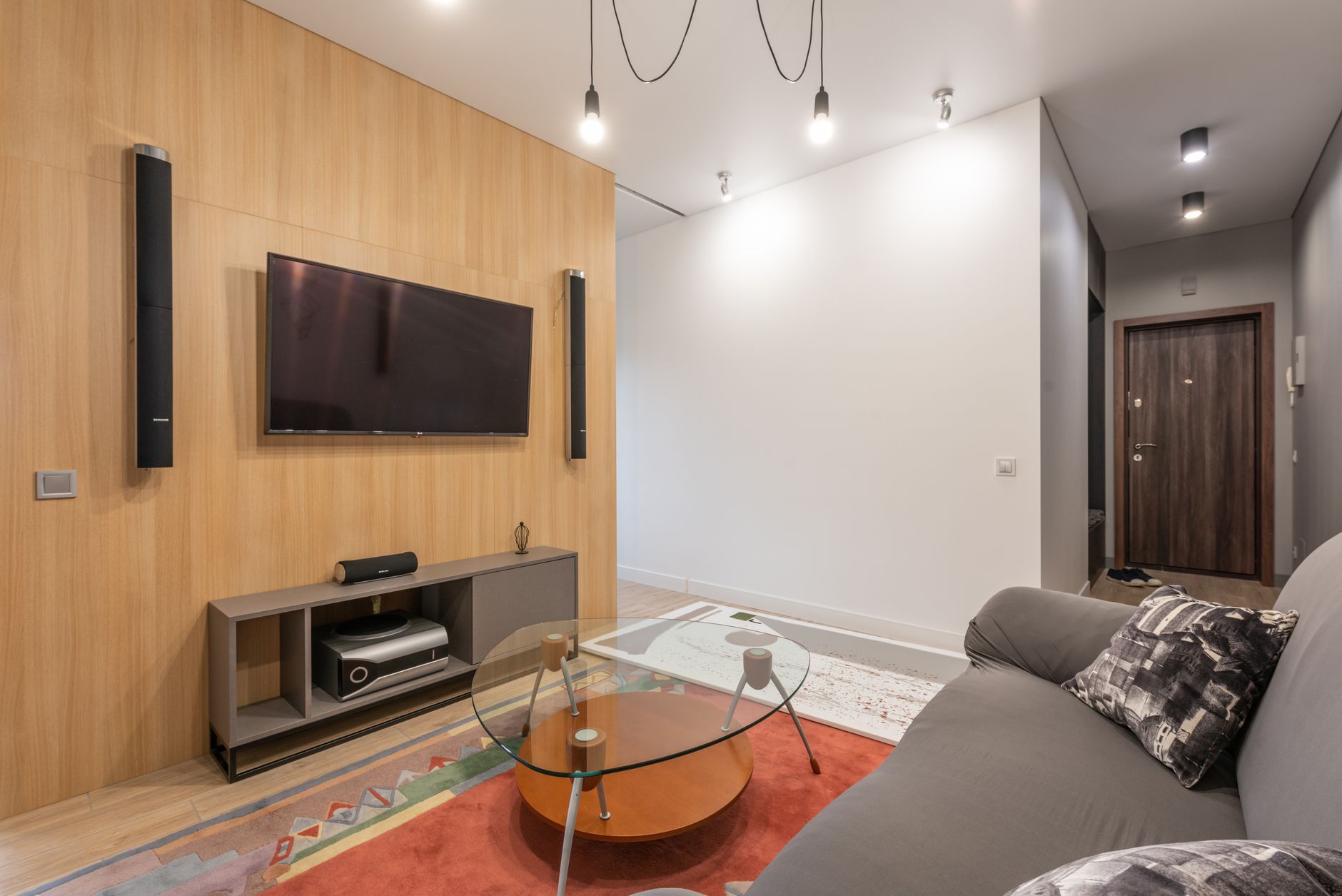 Smart Bulb vs Smart Plug: Which Should You Buy for Home Automation? 2 Modern living room demonstrating smart bulb vs smart plug usage for home automation